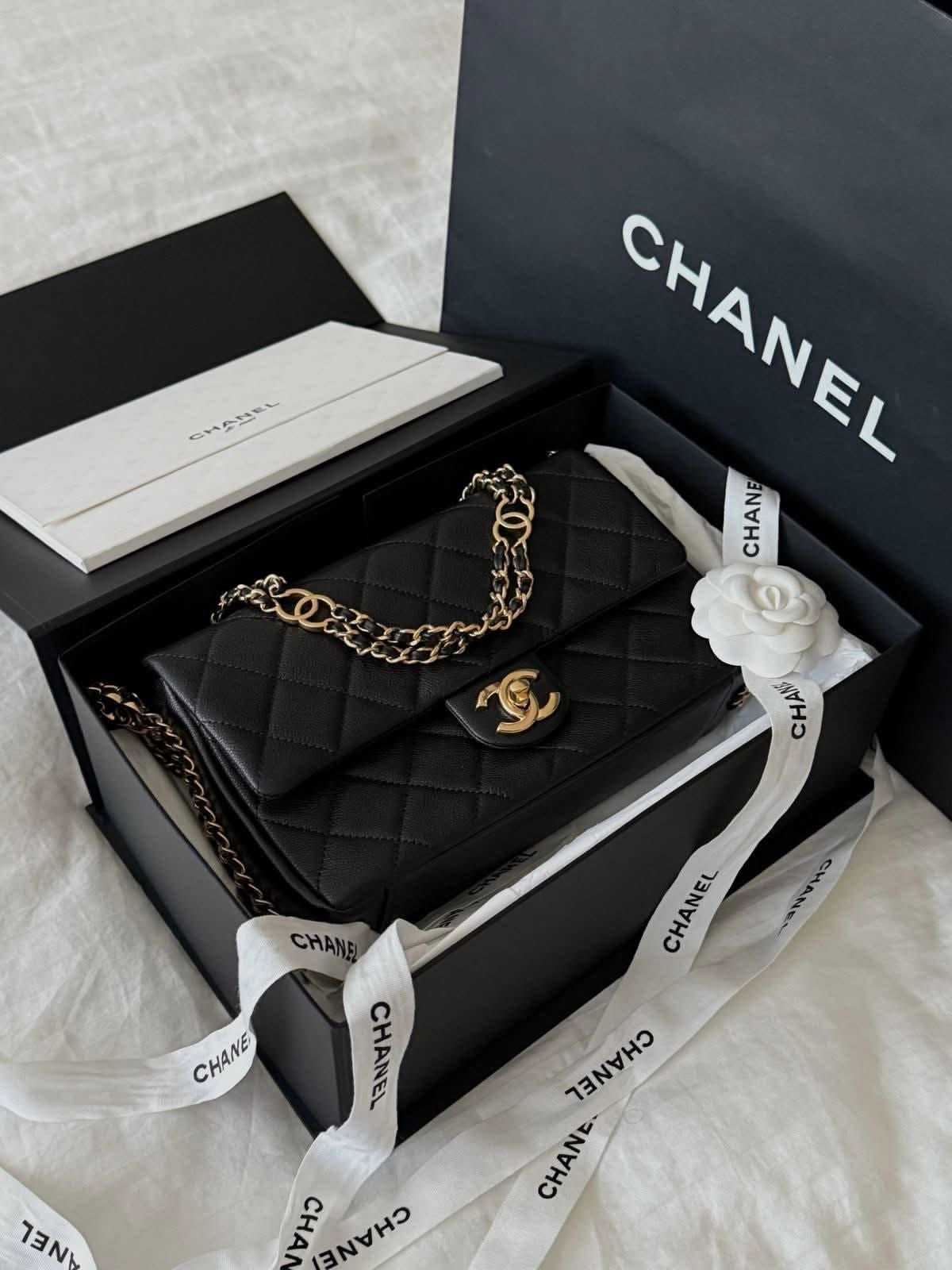 Black quilted Chanel bag in its presentation box